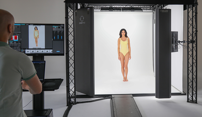 A model posing for photos in a photo studio