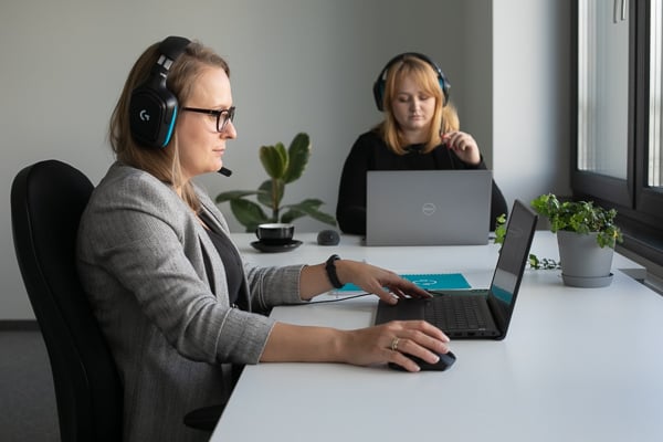 people in headset working at computers