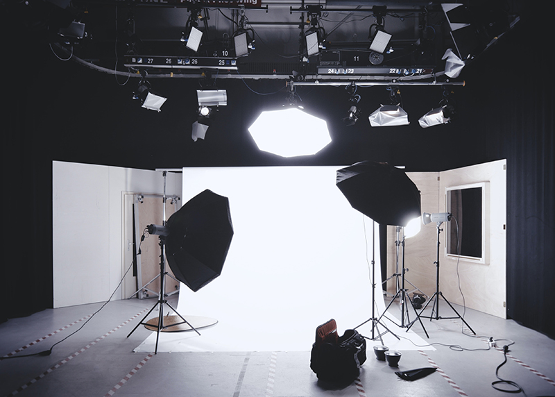 A traditional photo studio setup with continuous lights
