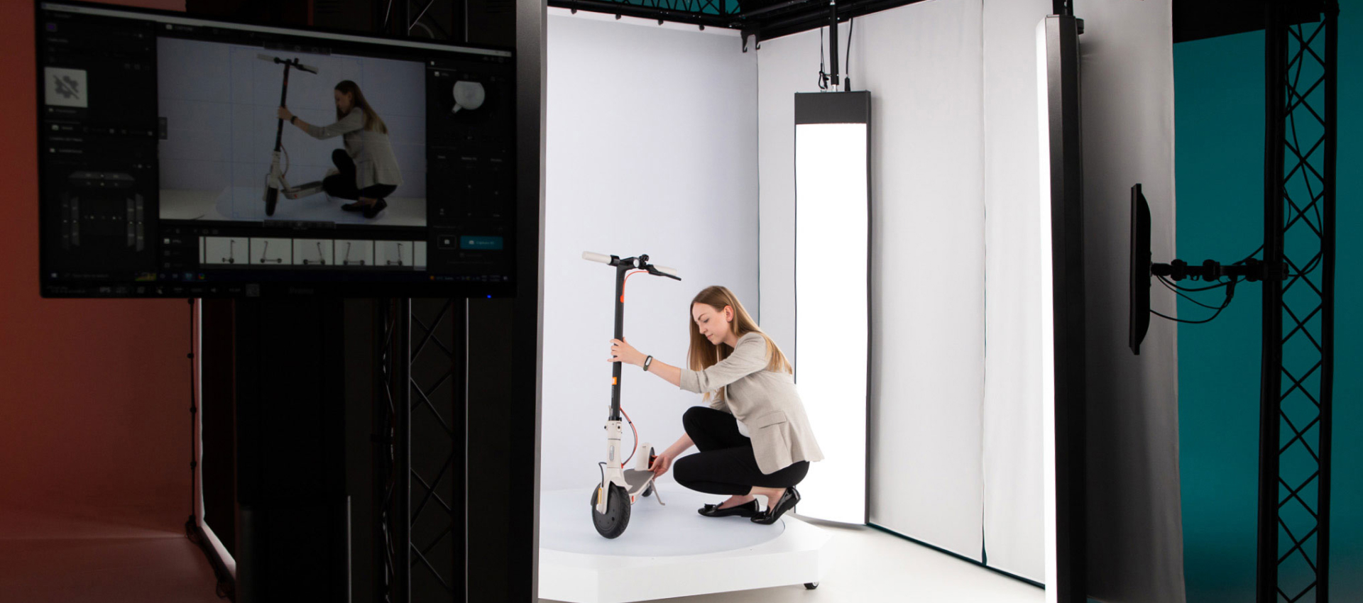 A woman placing a product on a platform in the Orbitvu automated solution