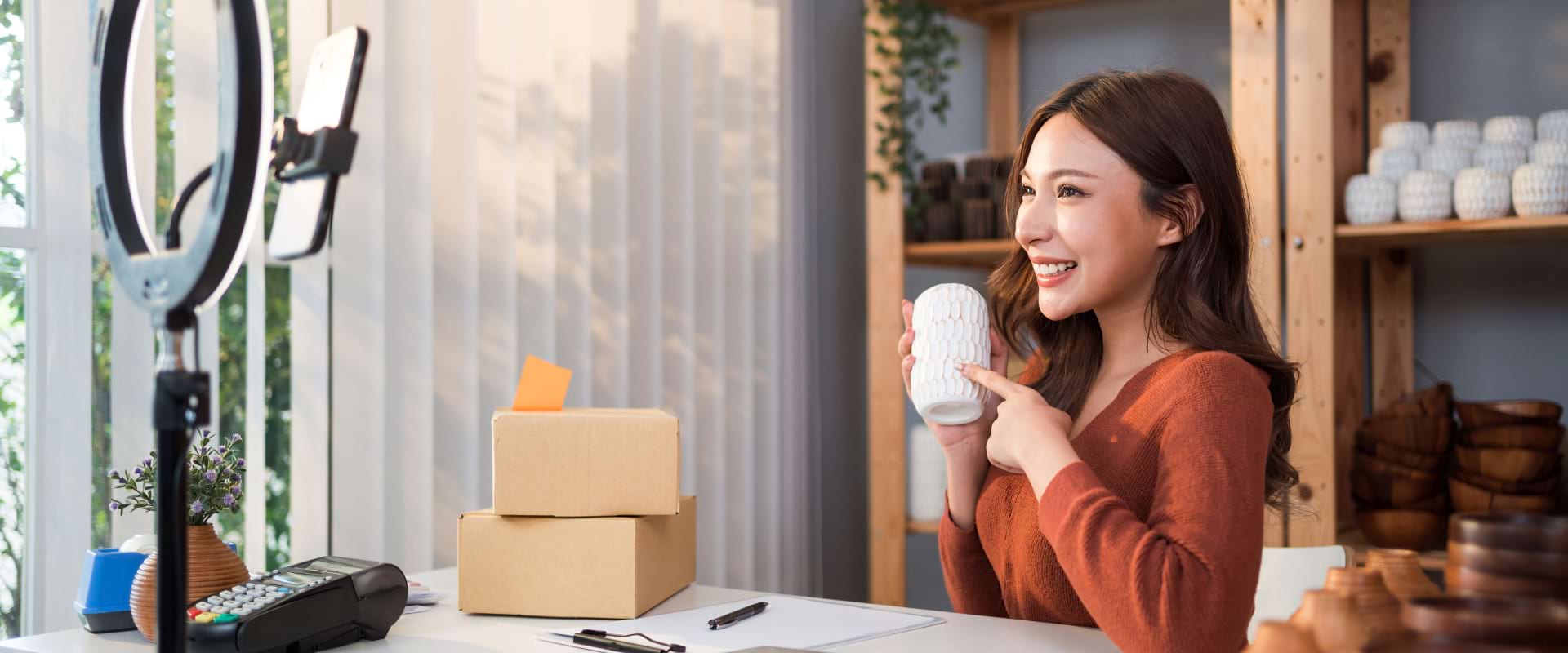 Live shopping example with a person showcasing her ceramics