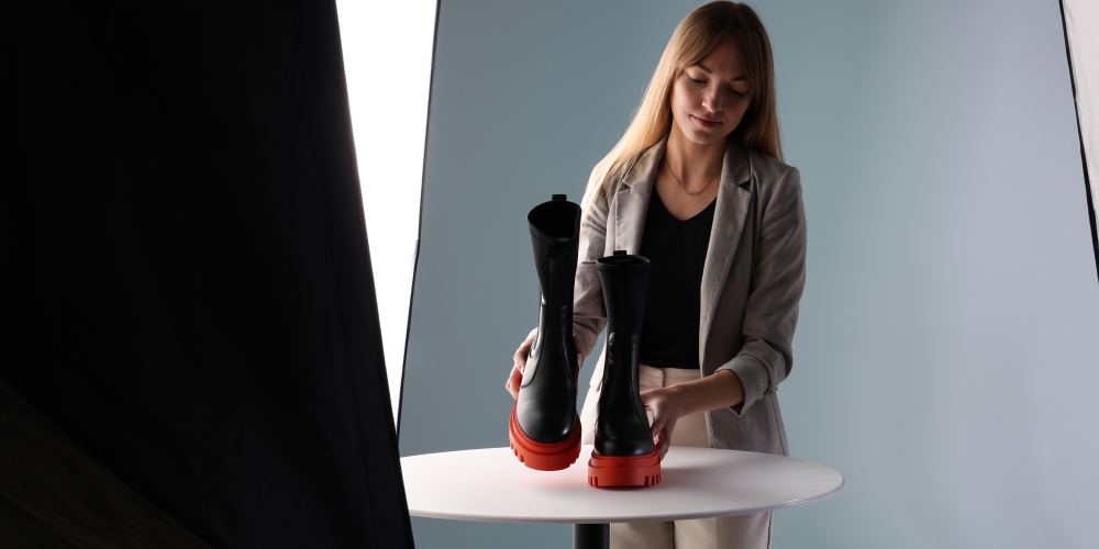 Woman placing rain shoes inside the Orbitvu Turntable